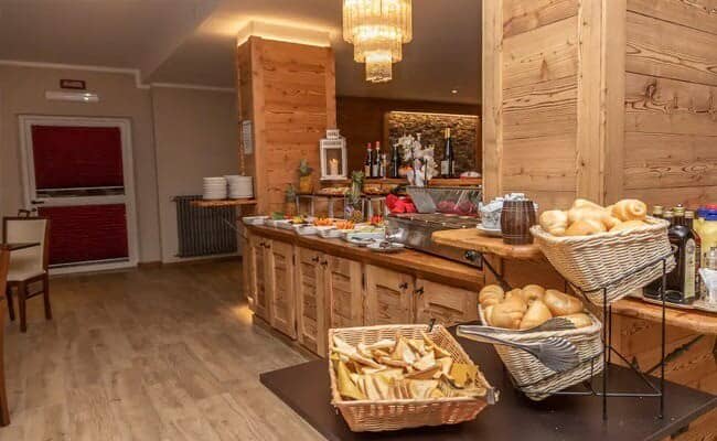 Buffet breakfast area with bread baskets and self-service stations