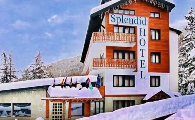 Hotel exterior with private balconies and mountain views