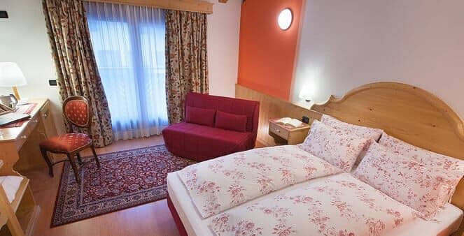 Guest bedroom with double bed and twin sleeper sofa