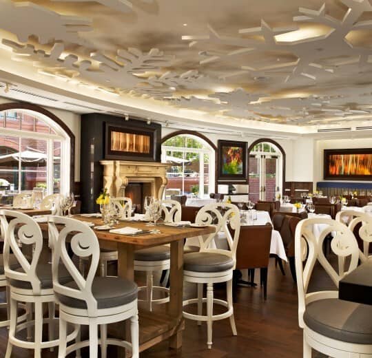 On-site restaurant with fireplace and bar-height table for 8