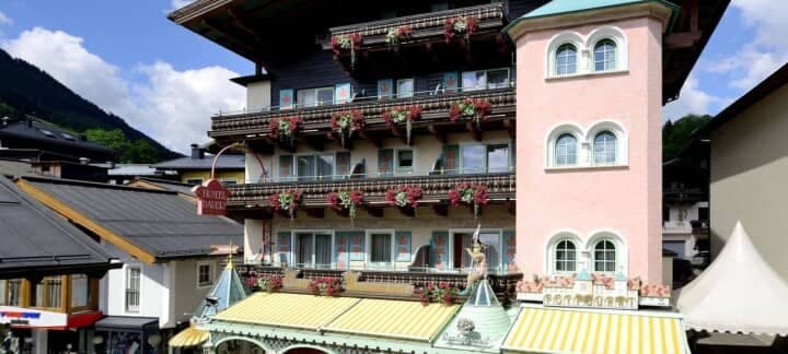 Chalet exterior with private balconies and flower boxes near the village center
