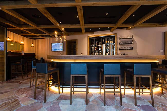 Private bar with flagstone flooring and seating for 4