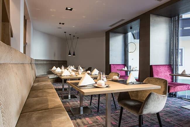 Dining area with banquette seating and window-side booths