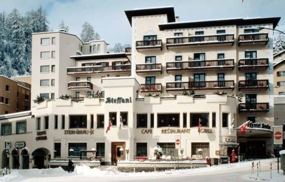 Hotel Steffani exterior with street-level cafe and private guest balconies