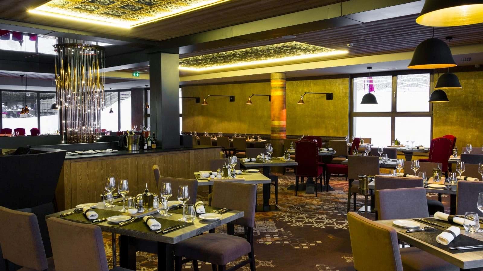 On-site restaurant with table seating and ski slope views