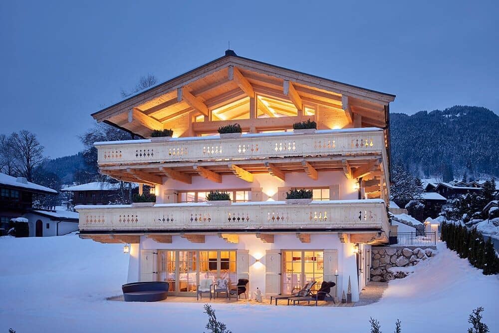 Chalet exterior with two levels of heated wrap-around balconies
