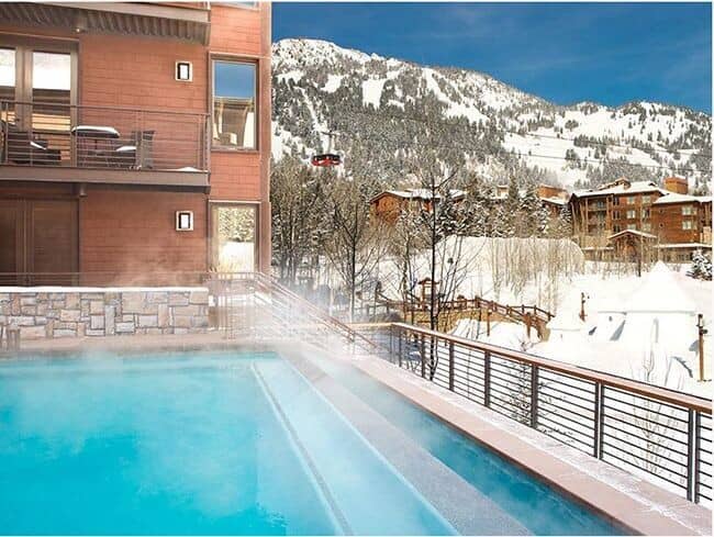 Heated outdoor pool with mountain views and gondola access