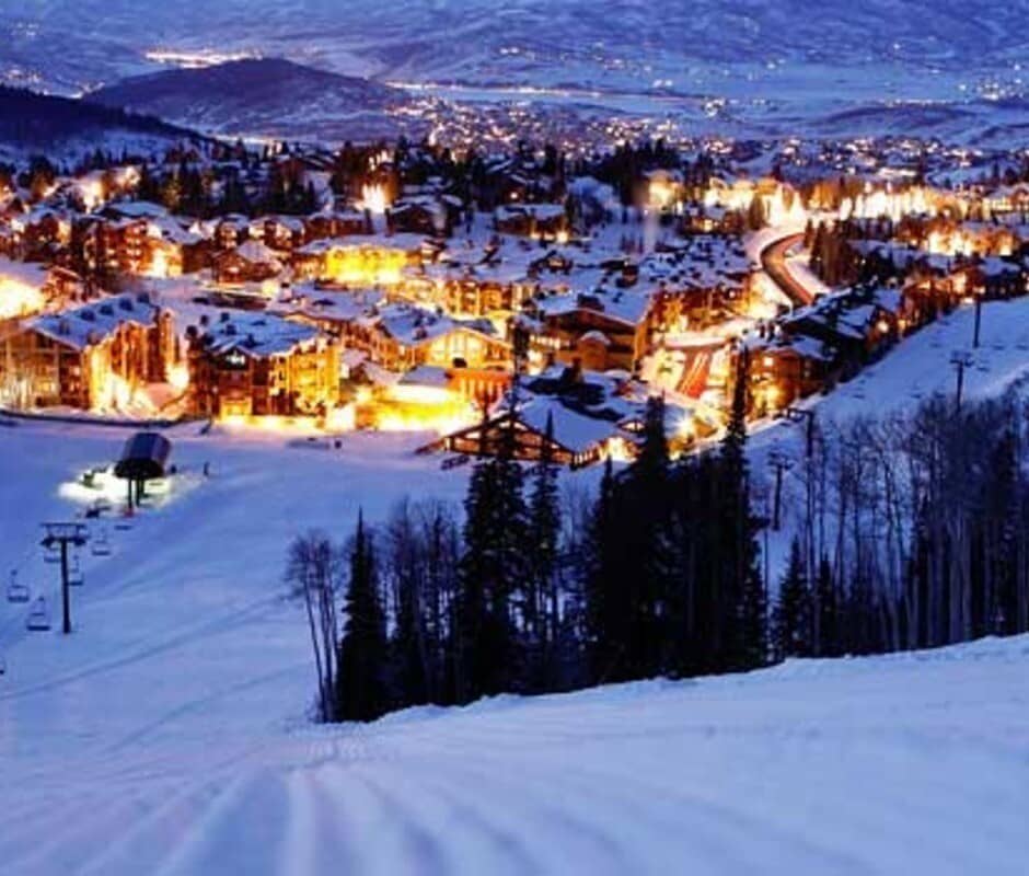 Ski-in/ski-out access; night view overlooking base village and chairlifts