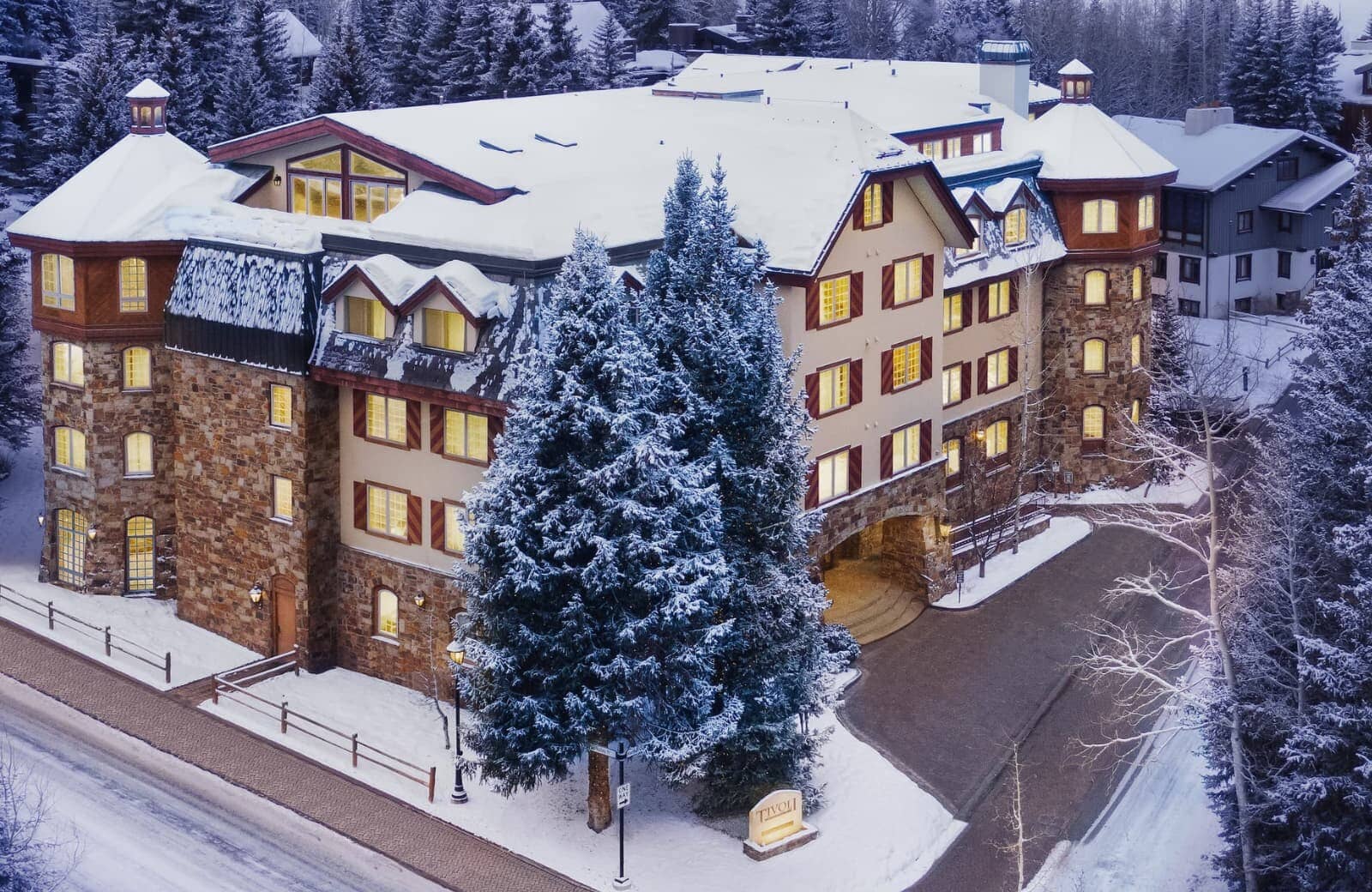 Ski-in/ski-out lodge exterior with stone facade and covered entryway