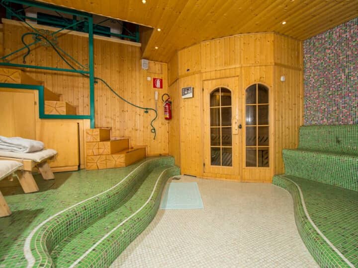 Spa area with Finnish sauna and tiled heated benches