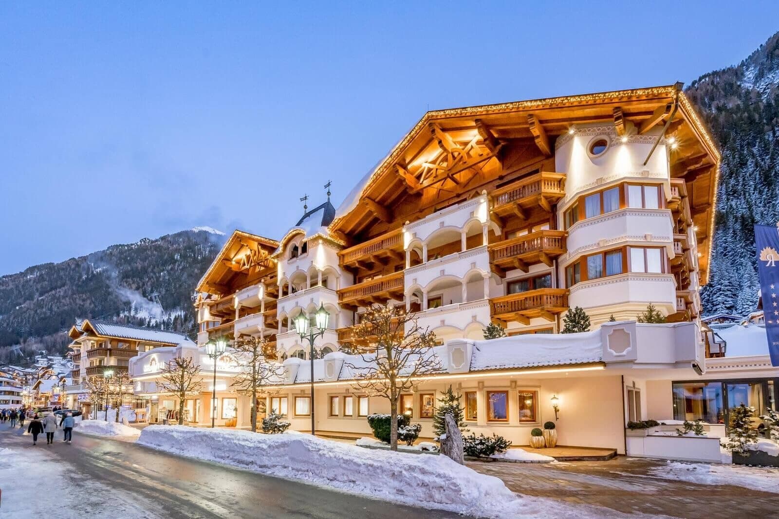 Chalet-style exterior with private balconies and village road access