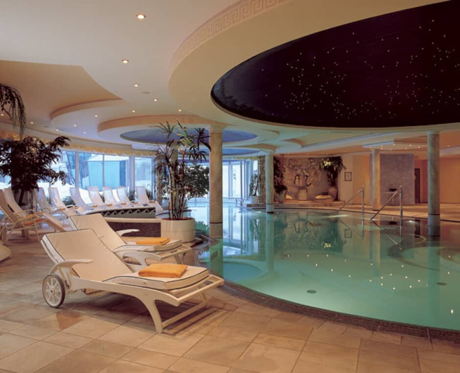 Indoor heated pool with lounge seating and fiber optic star ceiling