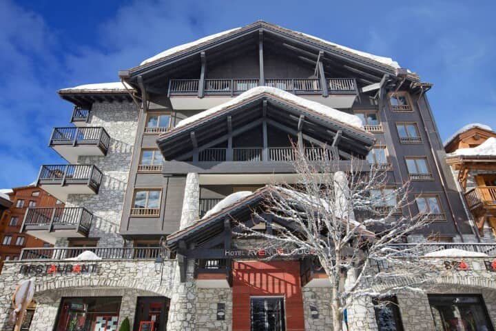 Ski chalet exterior with private balconies and on-site restaurant