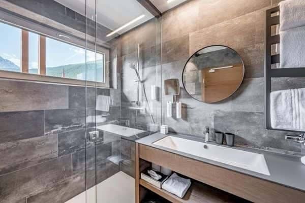 Bathroom with walk-in rainfall shower and heated towel rack