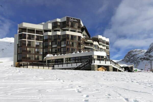 Ski-in/ski-out resort exterior with direct slope access and sun terrace