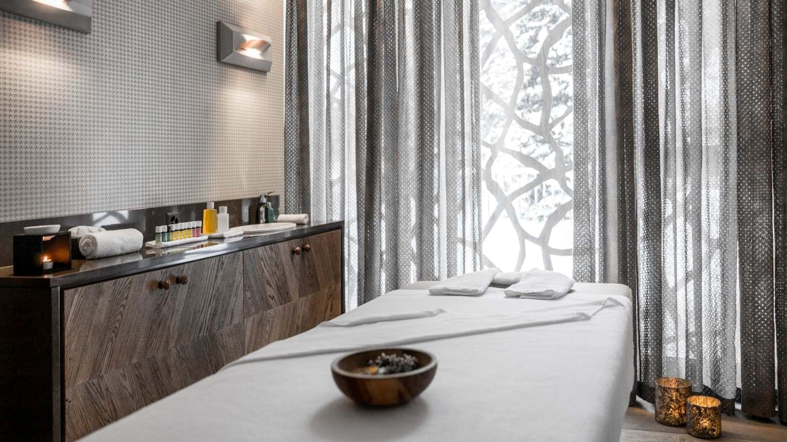 Private massage room with vanity and essential oils