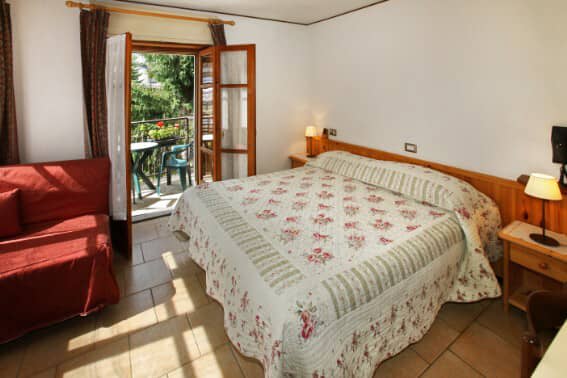 Bedroom with queen bed and private balcony access