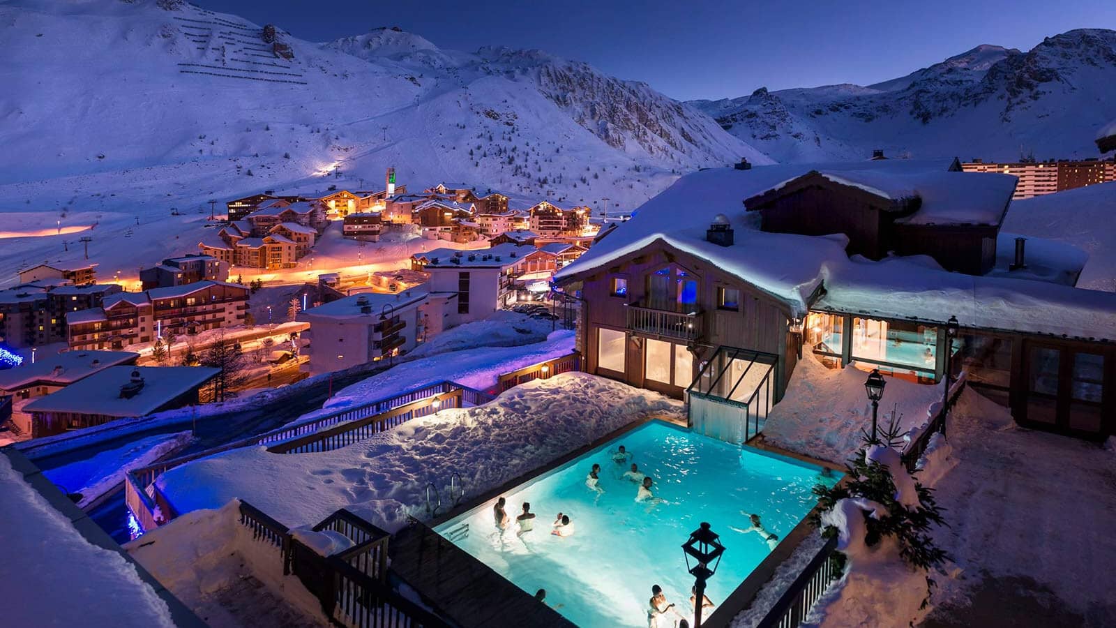 Heated outdoor pool with mountain views and swim-in access to chalet