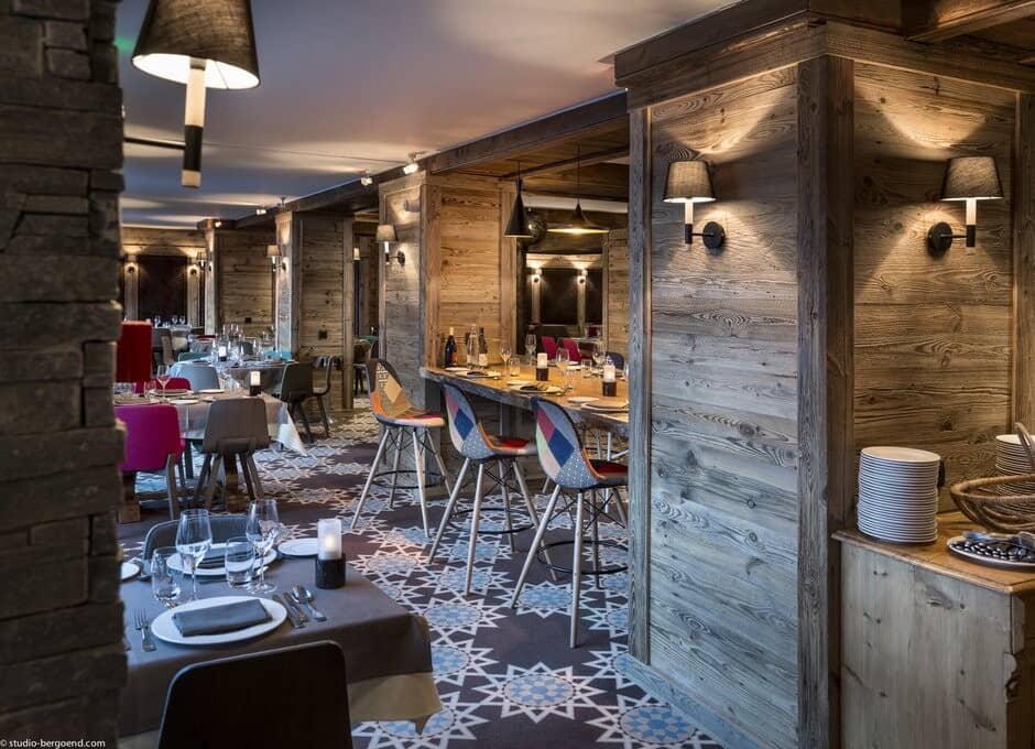 Dining area with reclaimed wood walls and breakfast bar seating