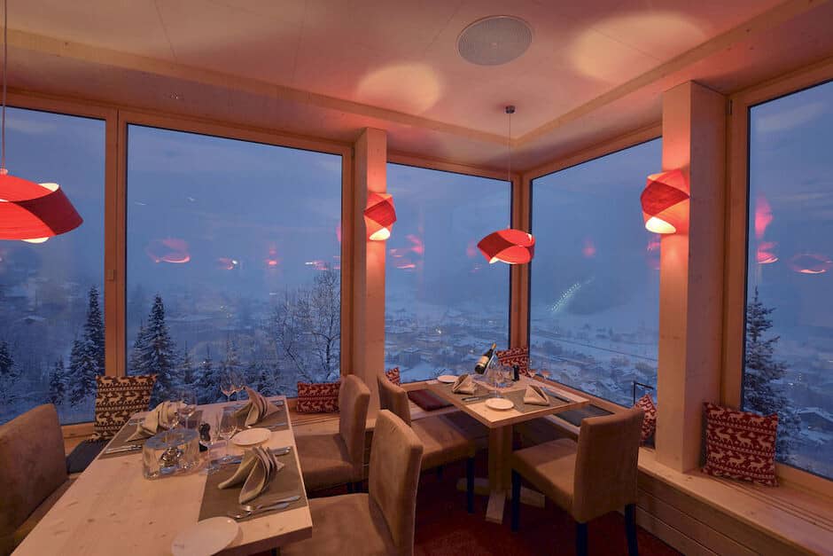 Dining area with floor-to-ceiling windows and panoramic valley views