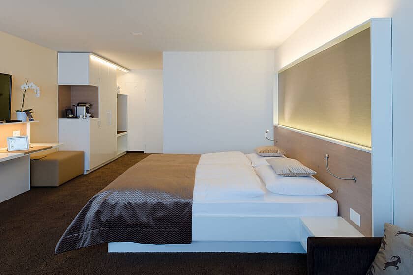 King bedroom featuring integrated desk and coffee station