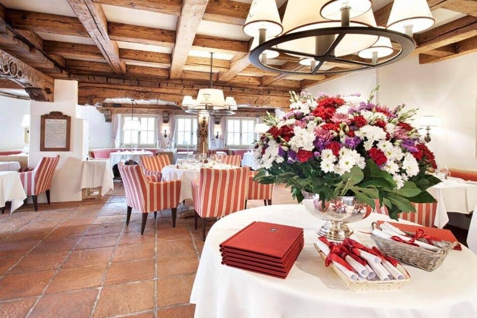 Dining room with hand-carved timber beams and terracotta tile floors
