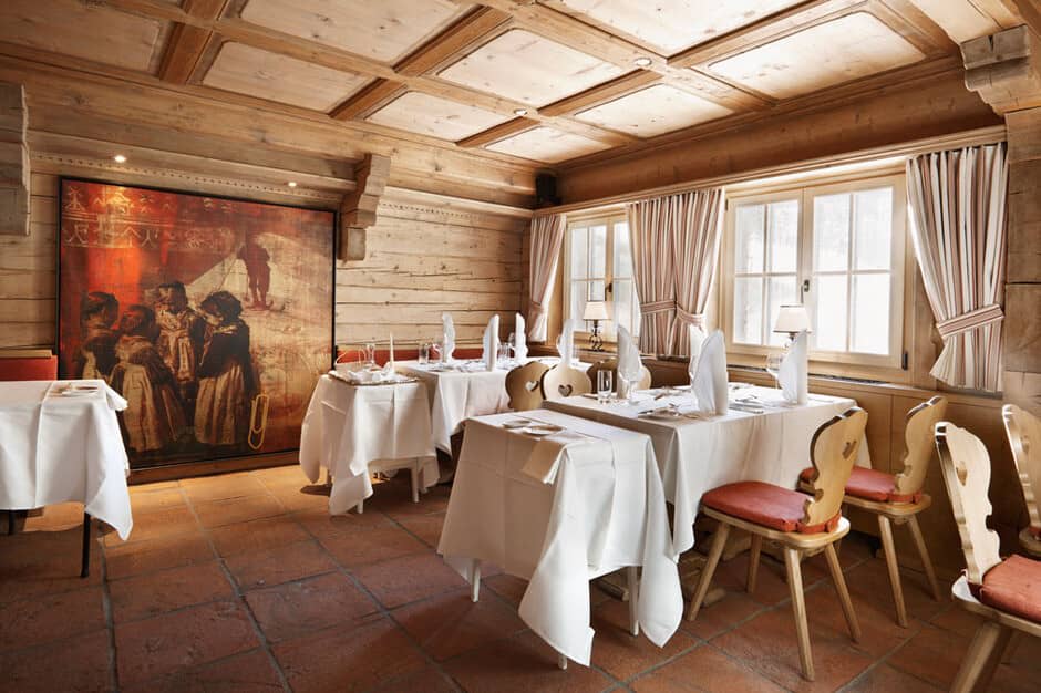 Dining room with coffered wood ceiling and terracotta tile flooring