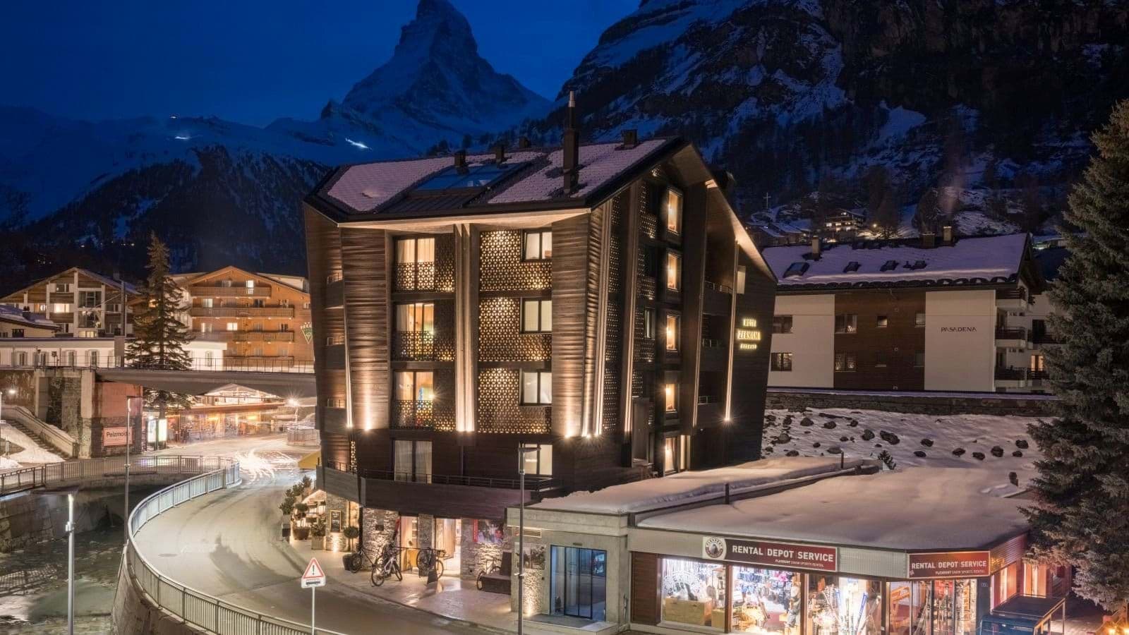Chalet exterior with Matterhorn views and ski rental shop on-site