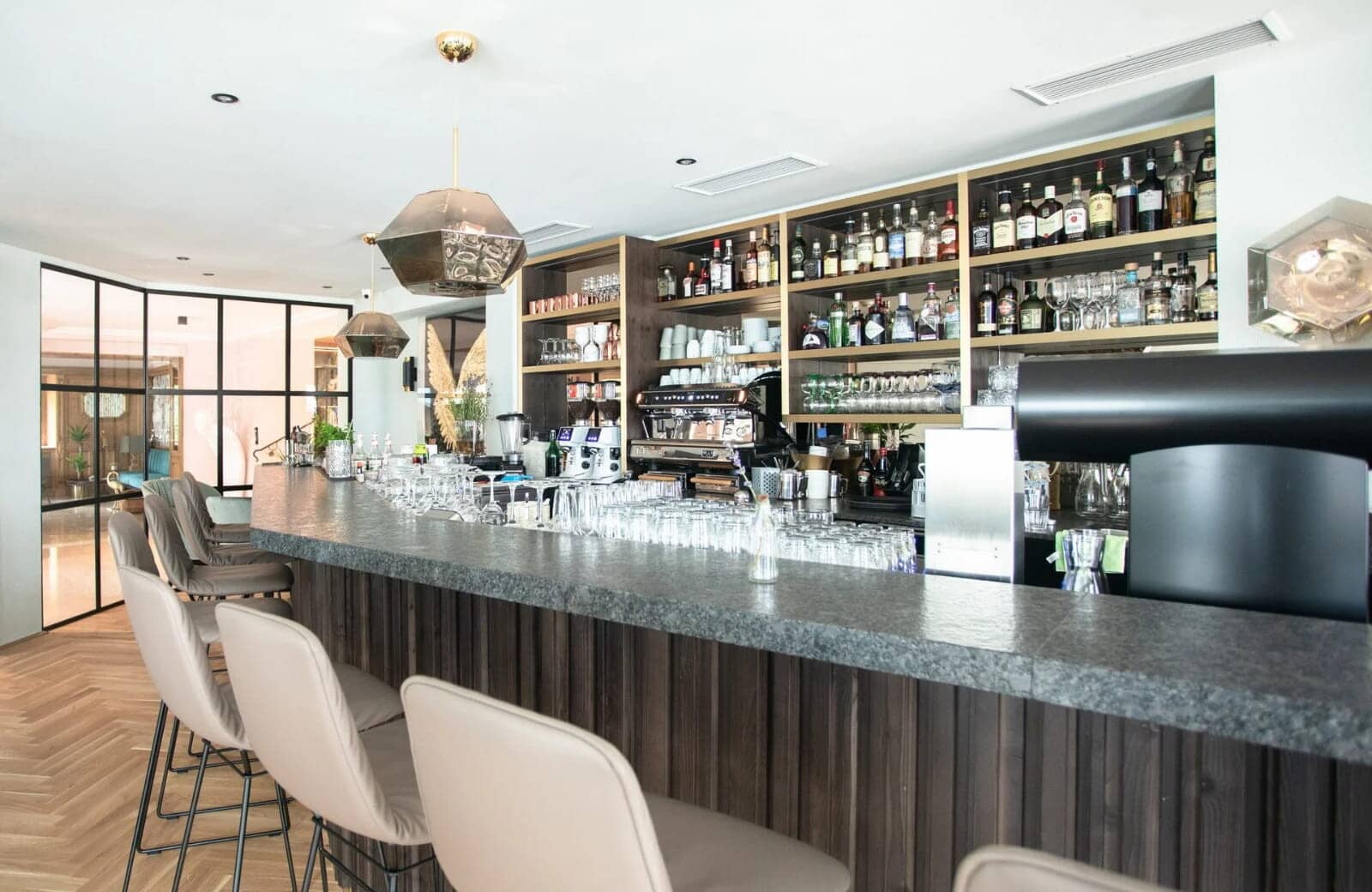 Full-service cocktail bar with espresso machine and seating for 7