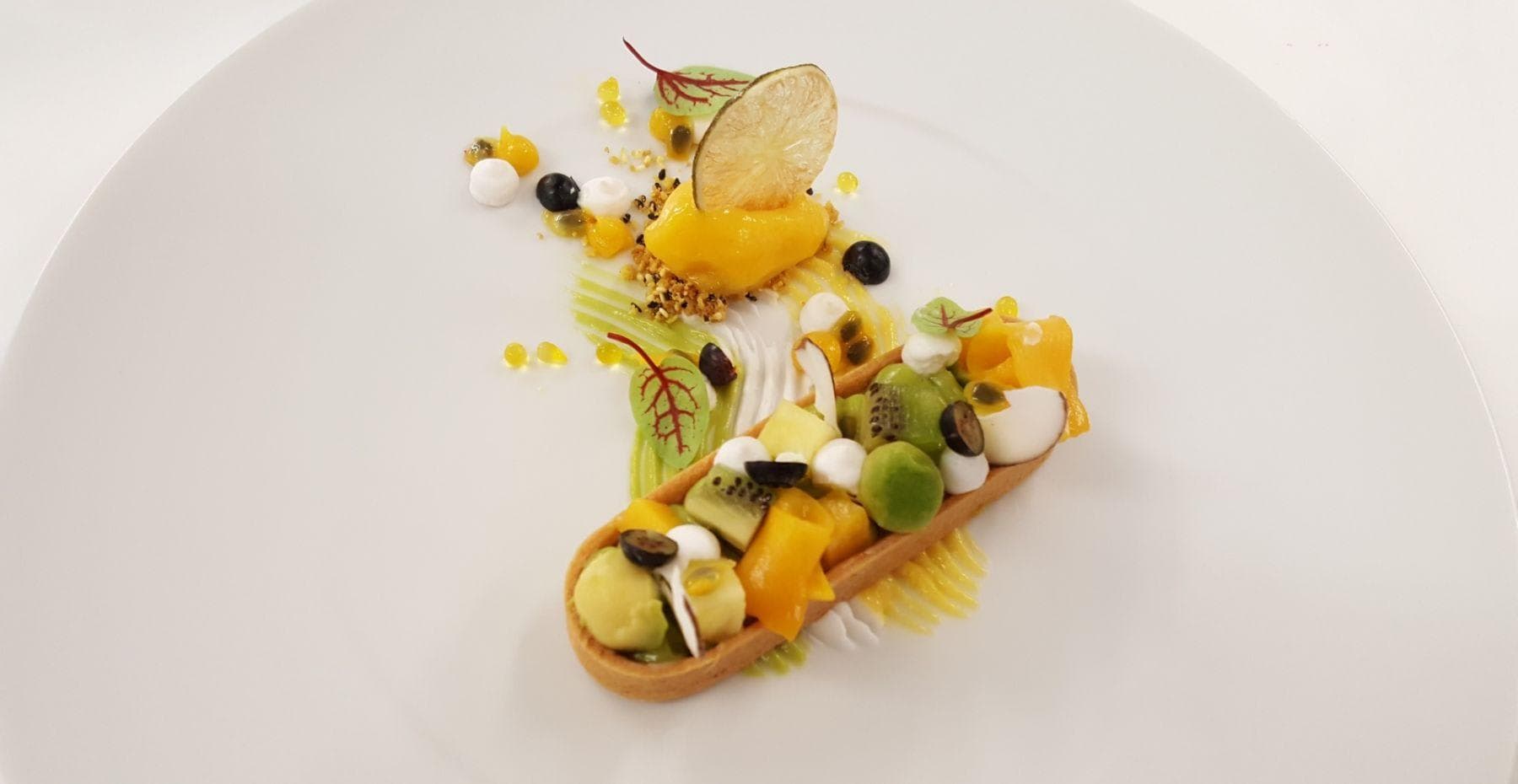 Private chef service featuring plated desserts with seasonal fruit tarts