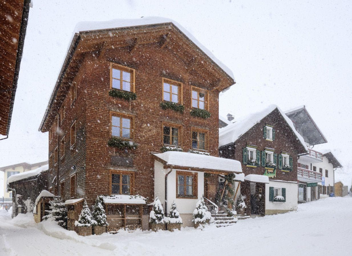 Traditional timber chalet with firewood storage and heated entryway porch