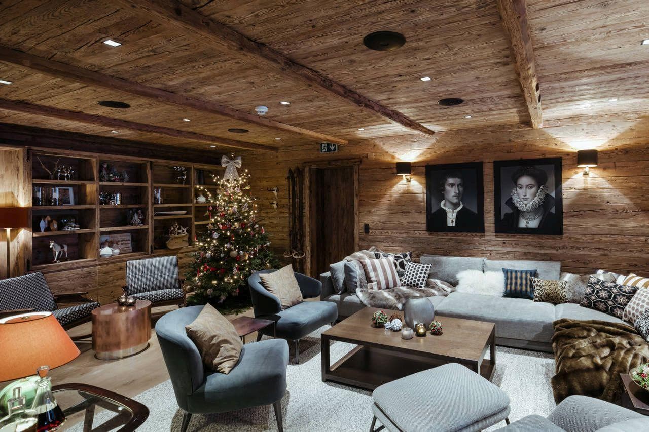 Living area with reclaimed wood walls and seating for 10