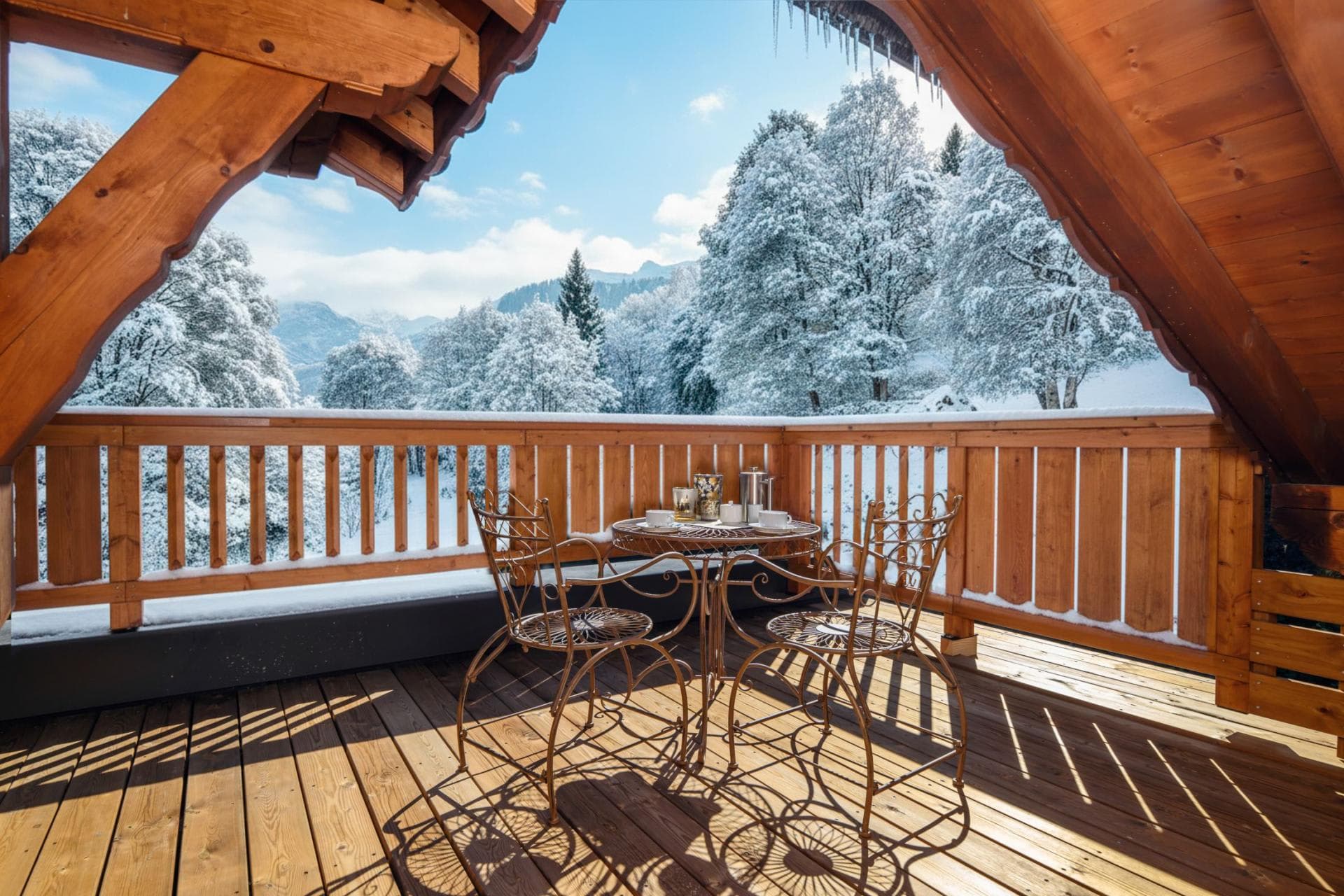 Covered balcony with bistro seating and forest views