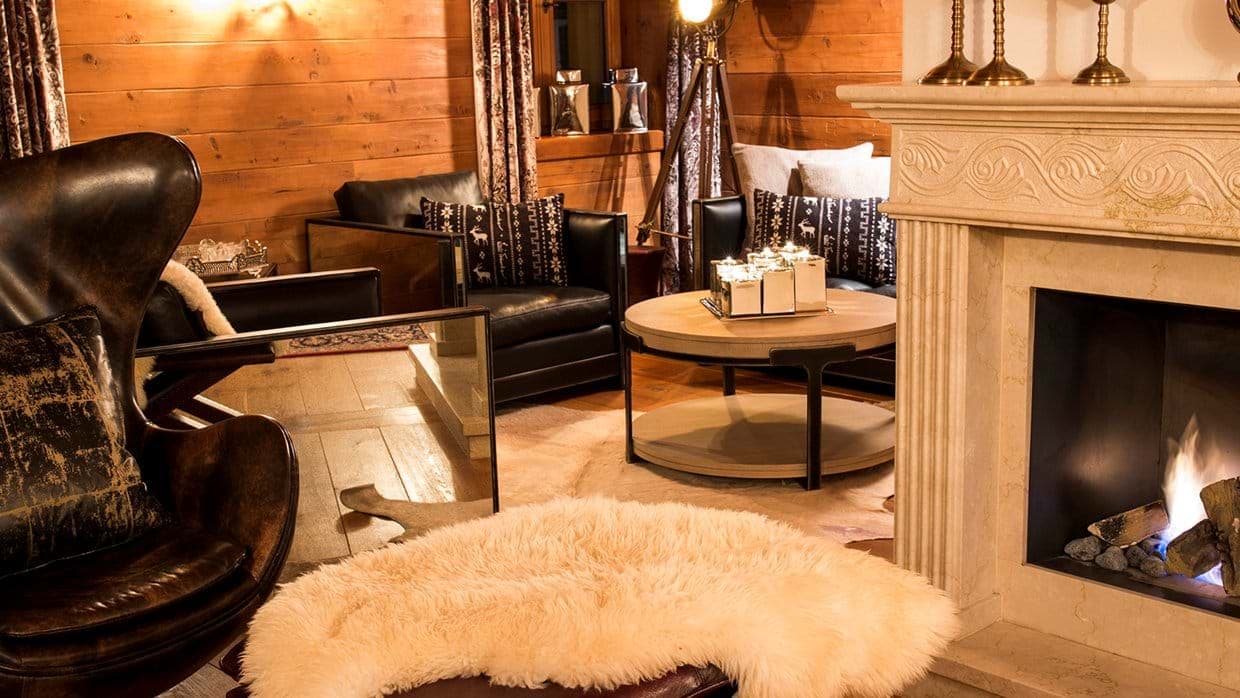 Seating area with gas fireplace and leather lounge chairs