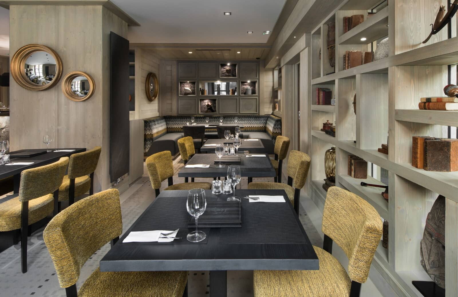 Dining area featuring banquette seating and tables for up to 20 guests