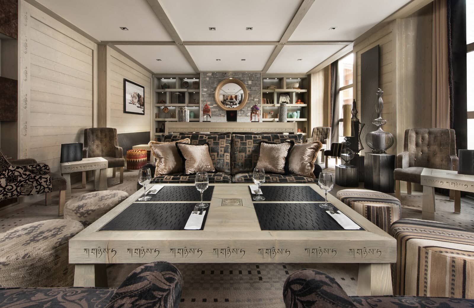 Formal lounge area with Tibetan-inspired decor and coffee table seating for four