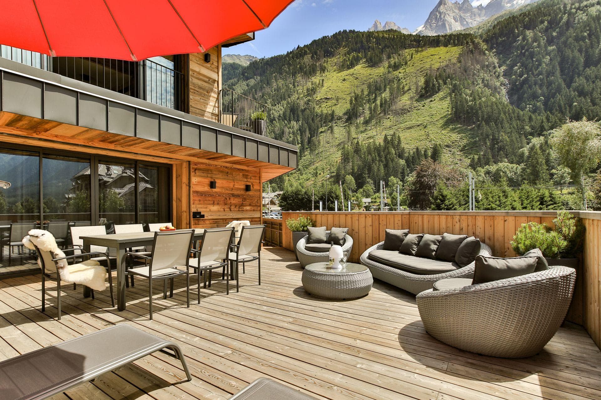 Wooden sun deck with dining for 8 and mountain views
