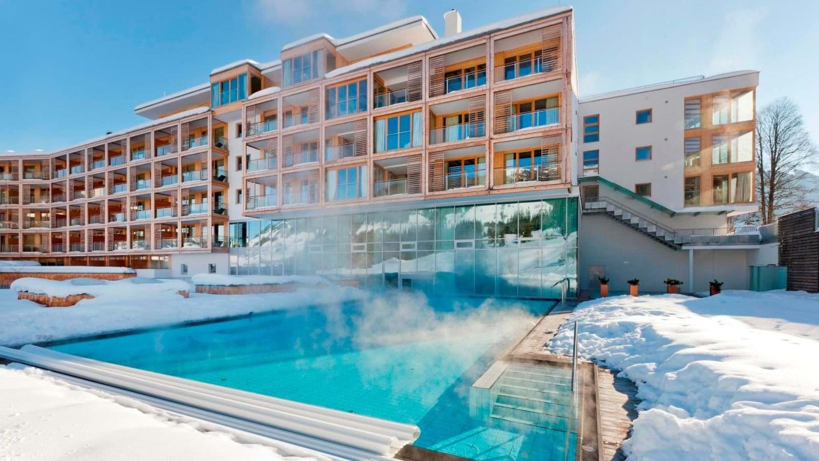 Heated outdoor pool with mountain views and private balcony access