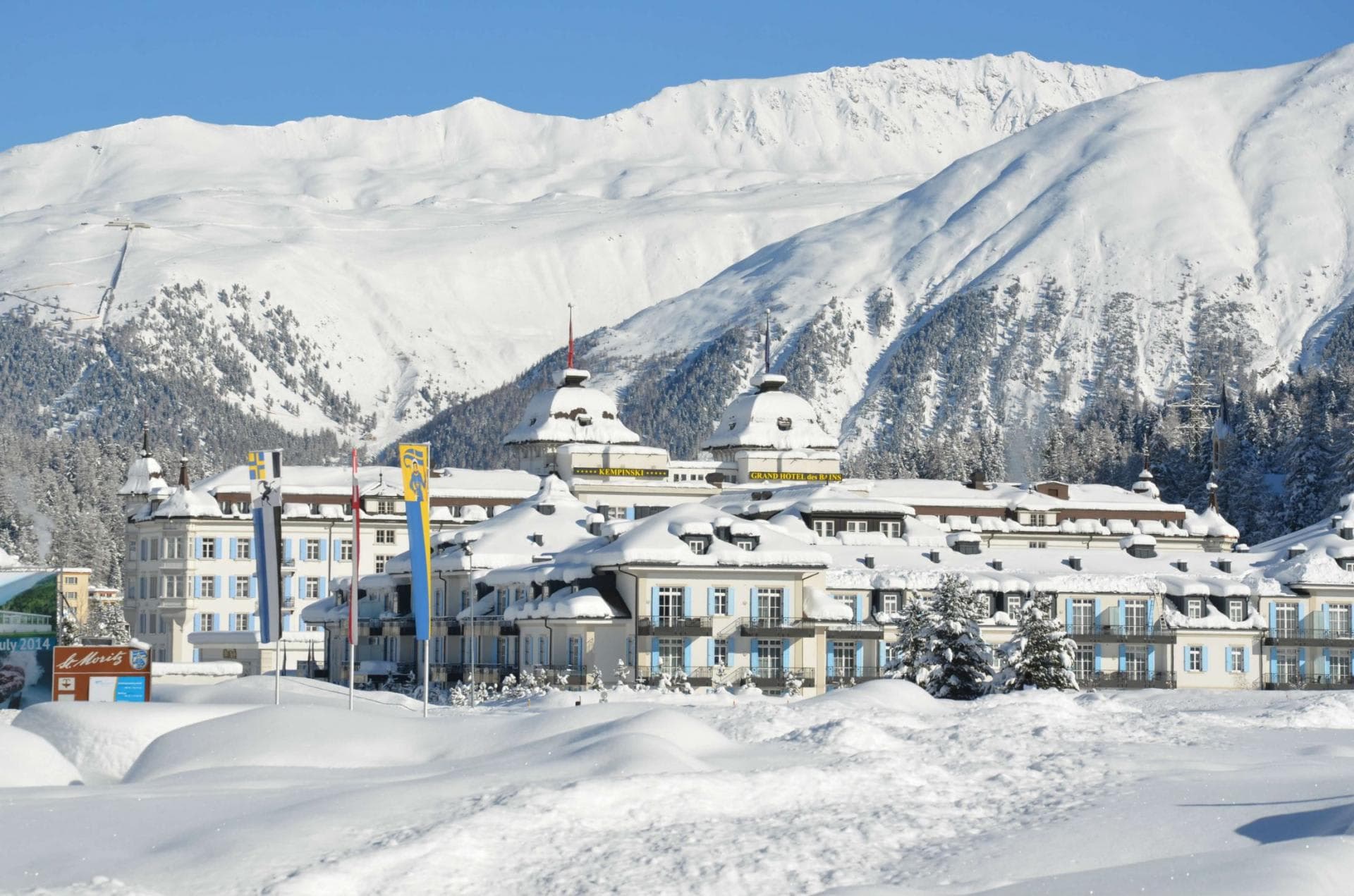 Ski-in/ski-out resort exterior with private balconies and mountain backdrop