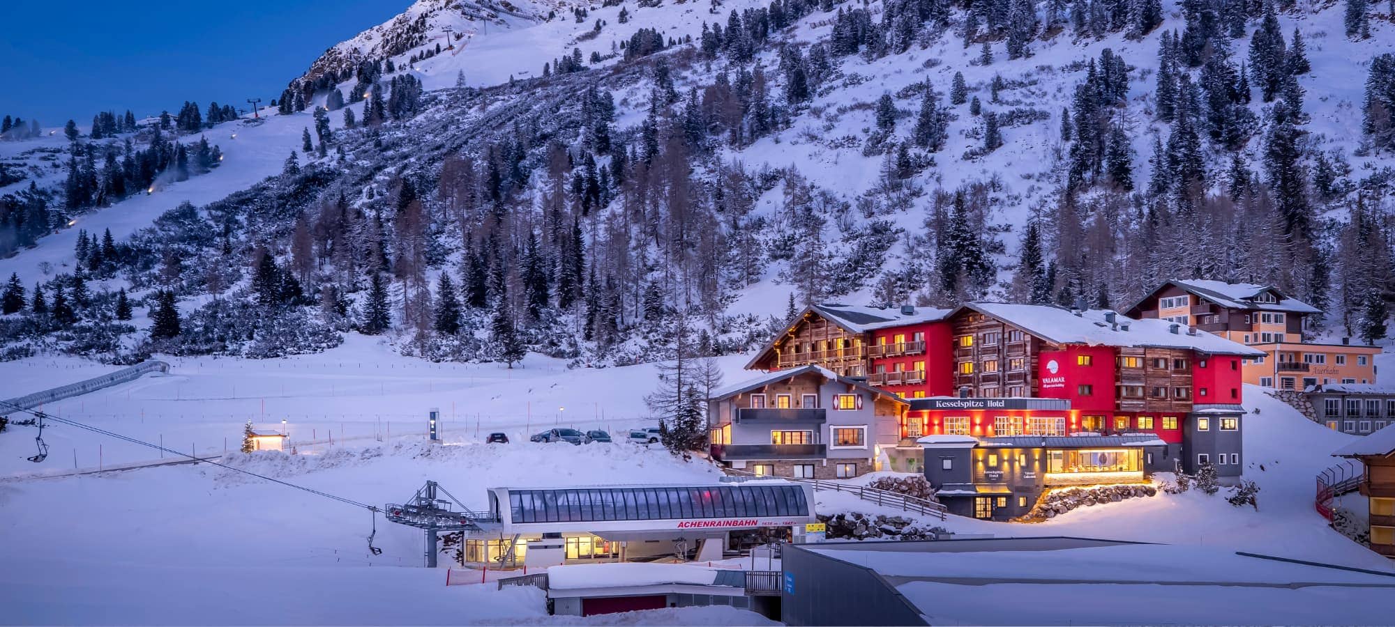 Ski-in/ski-out hotel exterior located directly adjacent to the Achenrainbahn chairlift