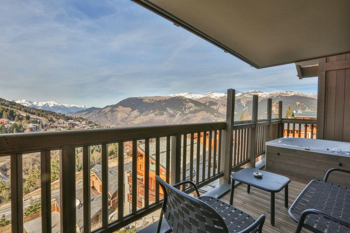 Private balcony with hot tub and mountain valley views