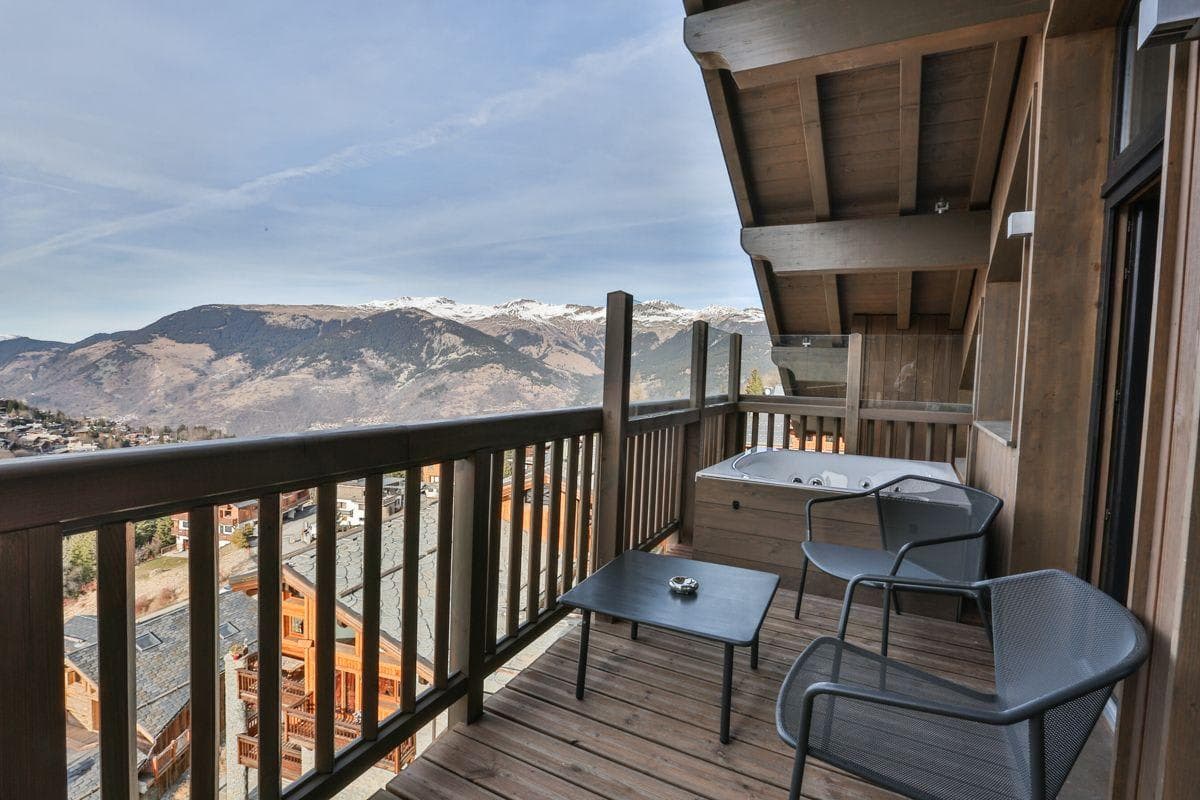 Private balcony with hot tub and mountain valley views