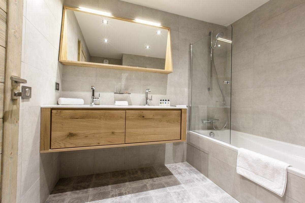 Bathroom with dual vanity and shower-tub combo
