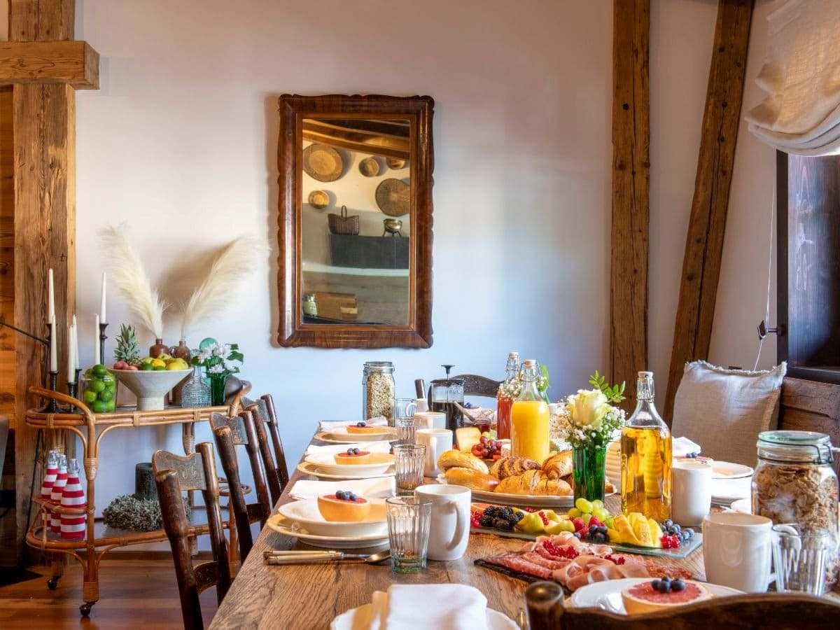 Dining table with seating for 8; includes original timber beams