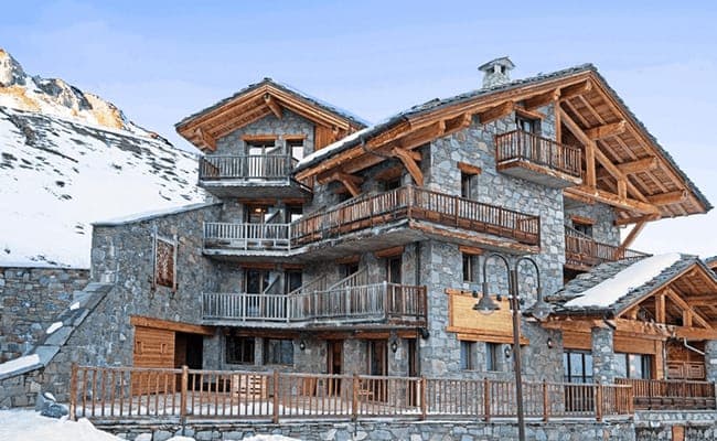 Stone and timber chalet with multiple private balconies and large terrace