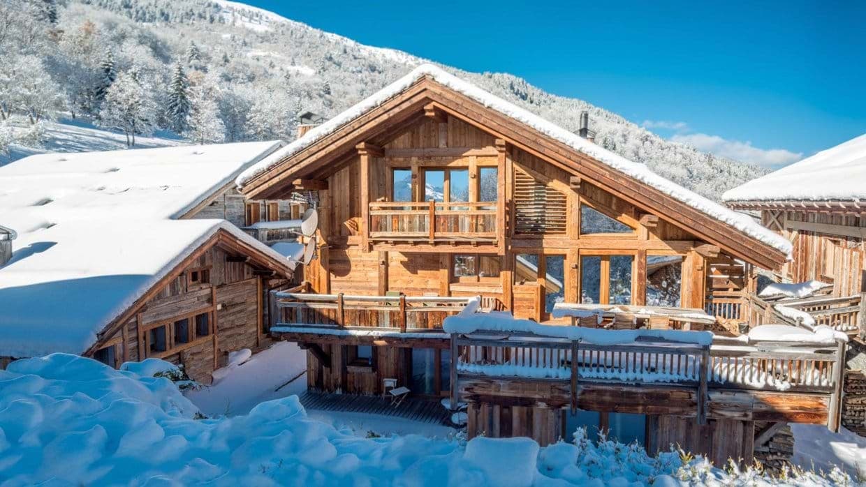 Ski-in/ski-out timber chalet with multiple sun decks and mountain views