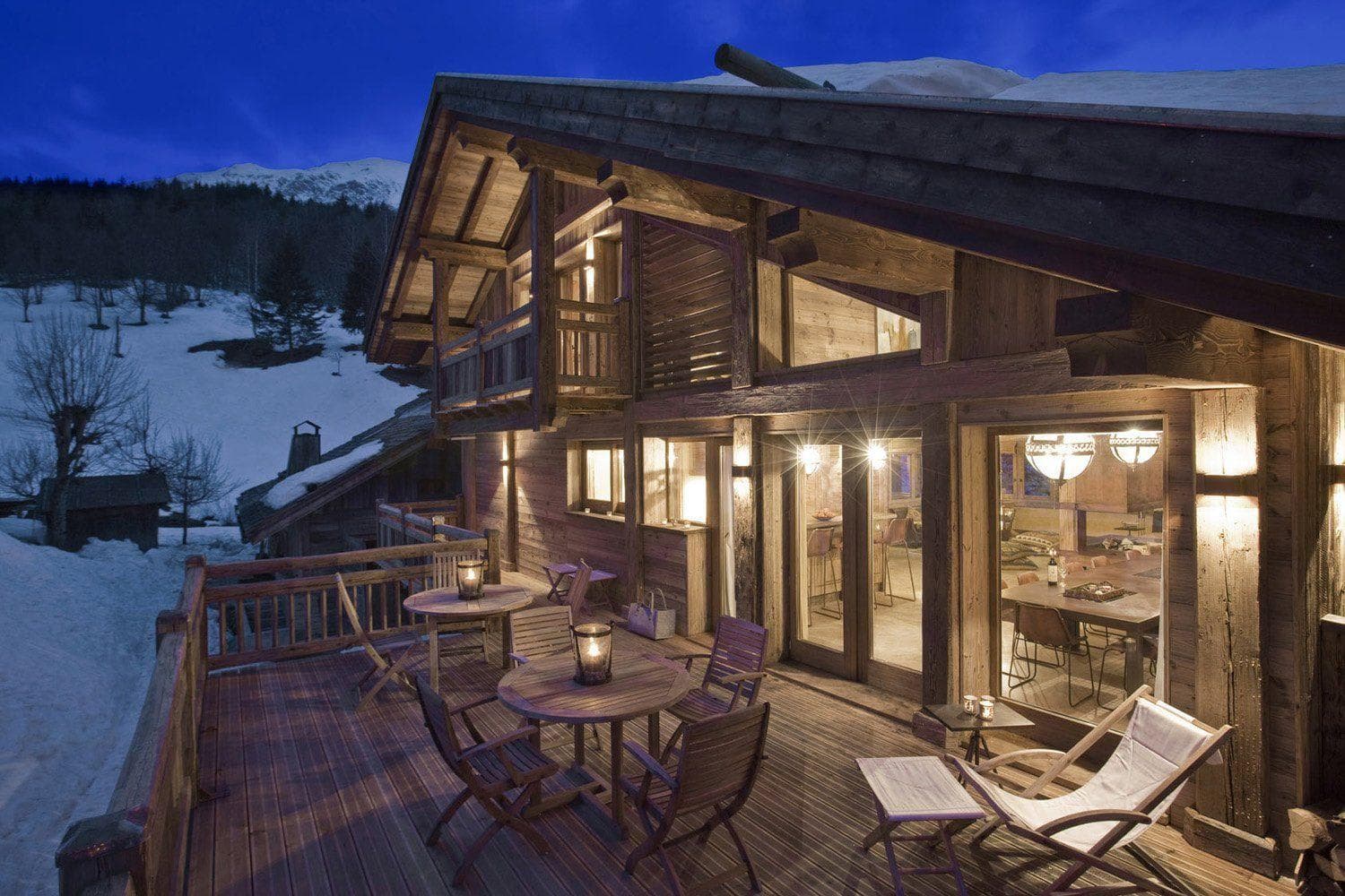 Timber deck with outdoor seating; mountain views and ski-in access