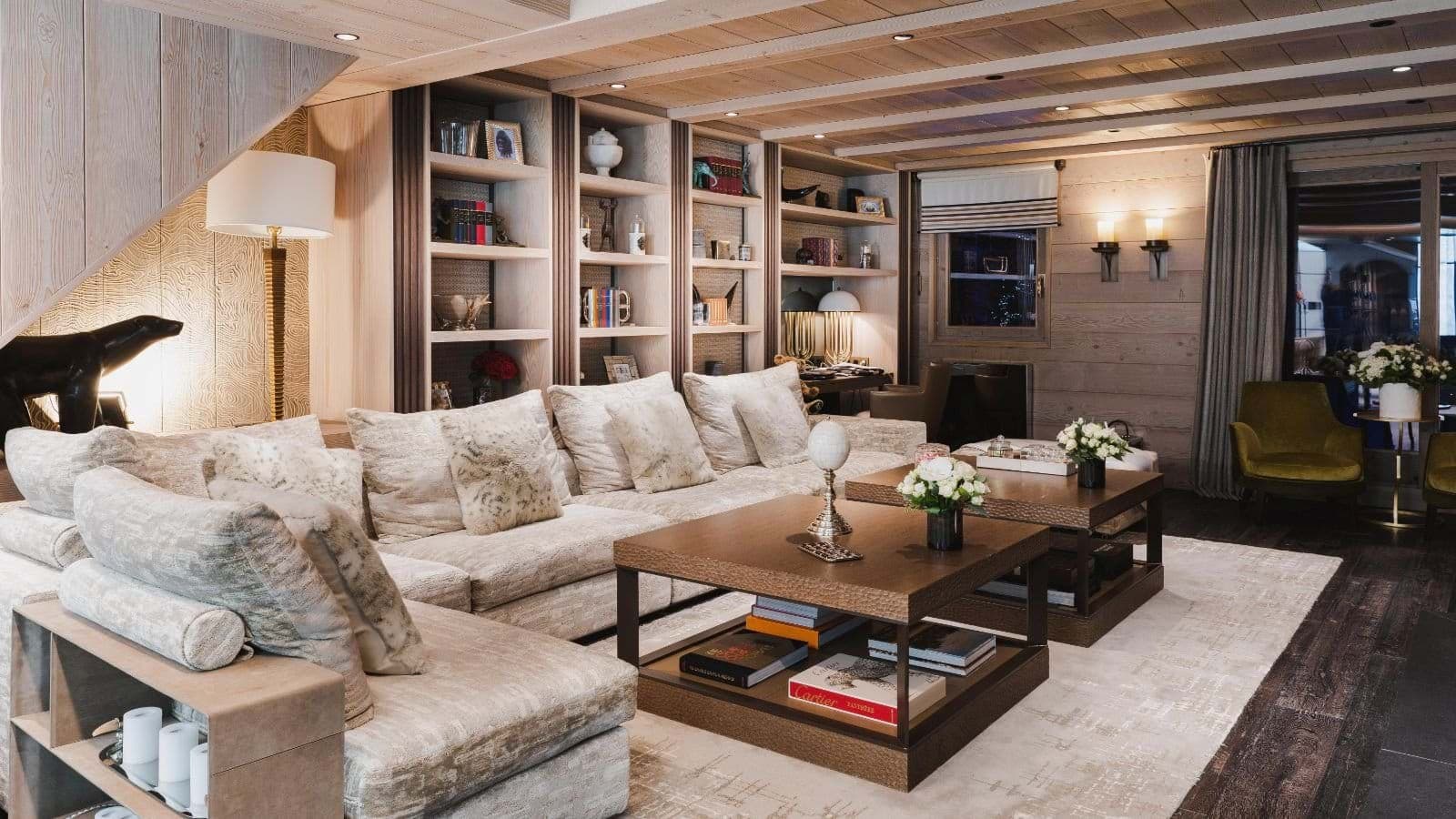 Lower-level lounge with deep-seated sectional and integrated workspace