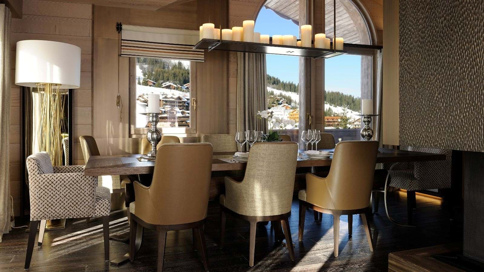 Dining area with seating for 8 and ski-in/ski-out village views