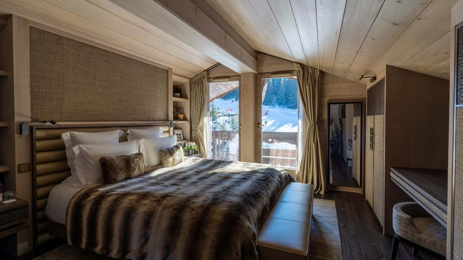 Primary bedroom with king bed and ski-in/ski-out piste views